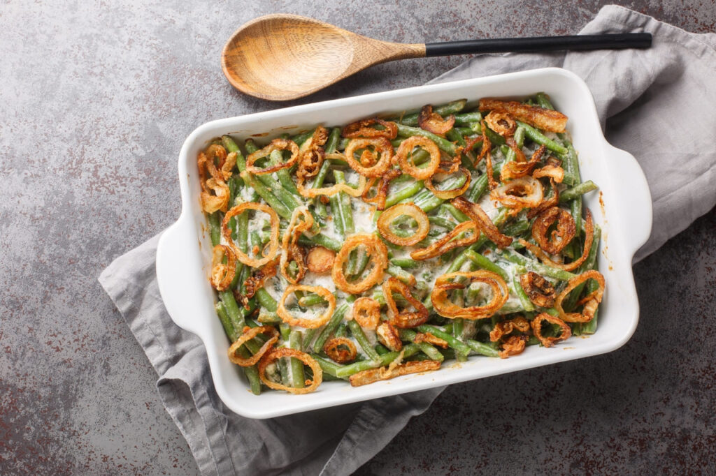 Green bean casserole topped with crispy onions.