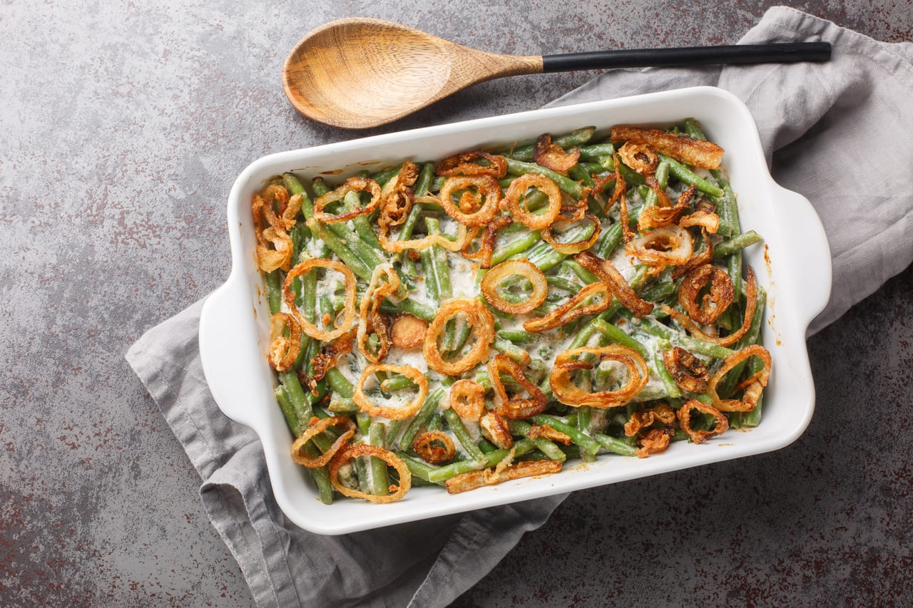 Green bean casserole topped with crispy onions.