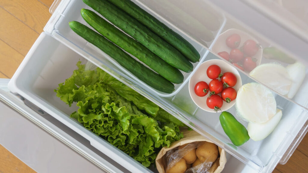 cucumbers stored neatly in a container
