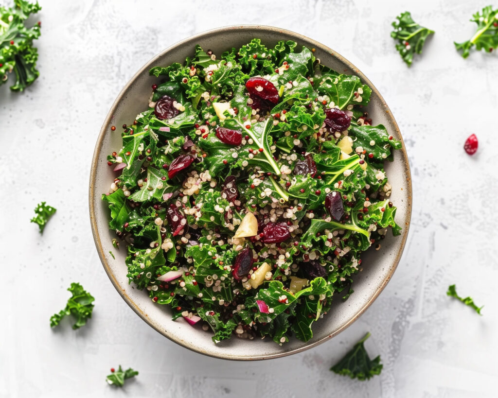 Kale and Quinoa Salad, Massaged kale mixed with cooked quinoa, dried cranberries, and a lemon-tahini dressing.