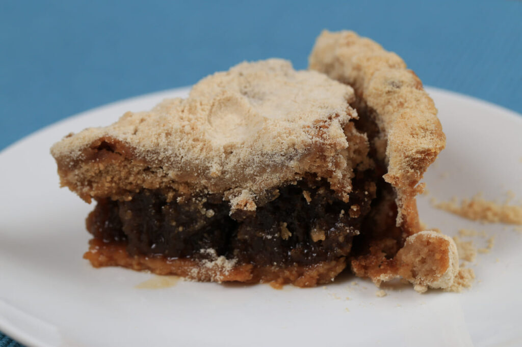 Shoofly Pie is a Pennsylvania Dutch dessert made of molasses with a wet, sticky and gooey bottom.