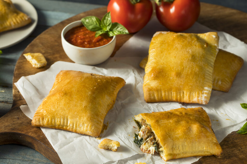 Homemade Sausage Pizza Pocket Calzone with Cheese and Marinara