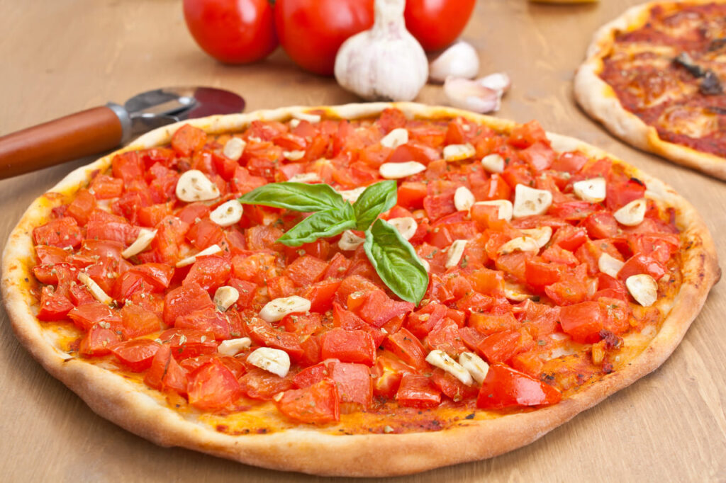 thin crust pizza alla marinara with tomatoes and garlic