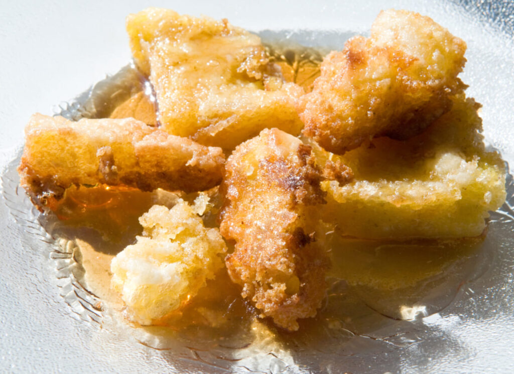 Fried corn meal mush with maple syrup - a traditional country and soul food dish 