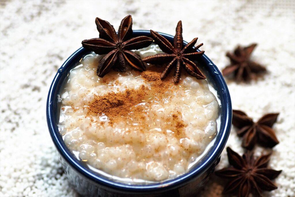 Creamy rice pudding sprinkled with cinnamon.