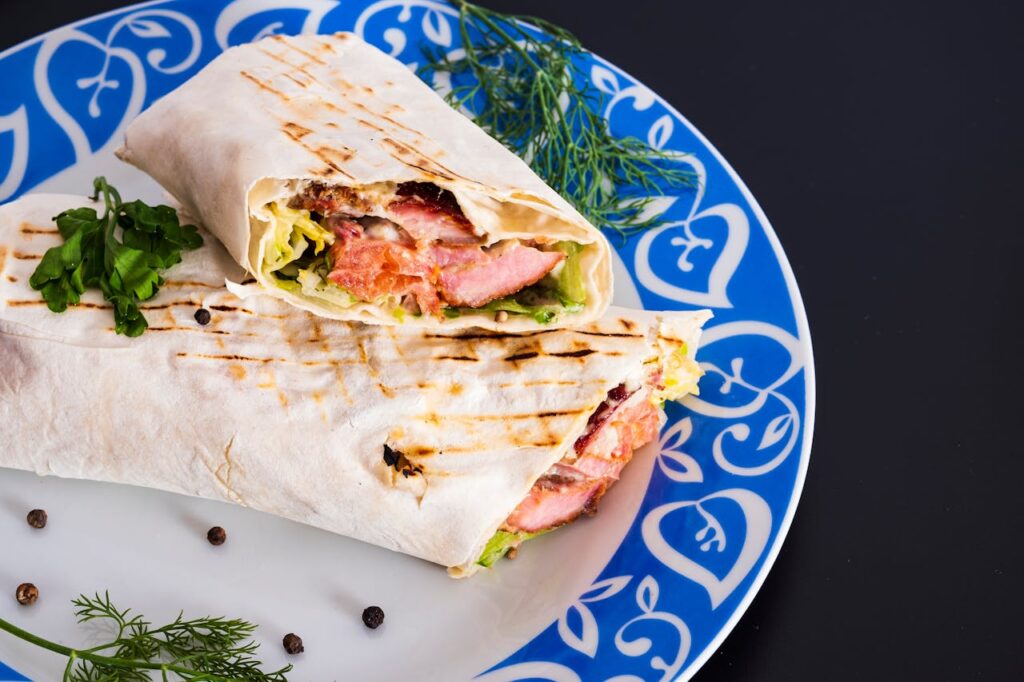 Stuffed pita halves with chicken, spinach, and tzatziki.