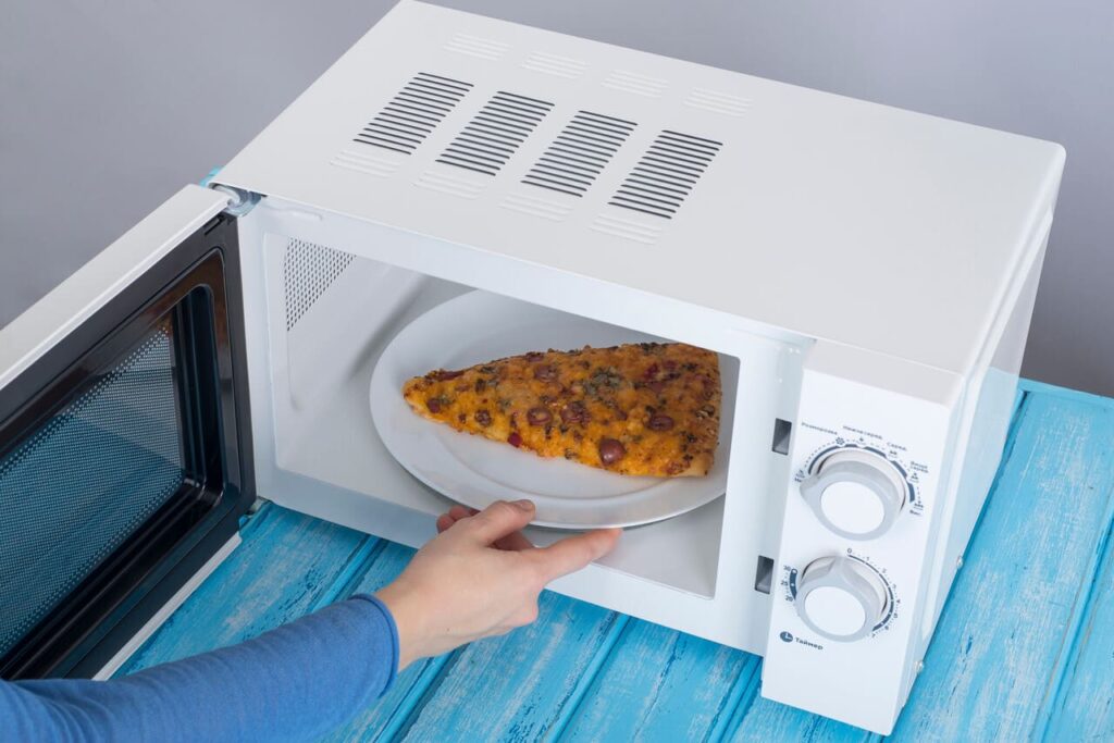 A plate coming out of a microwave.