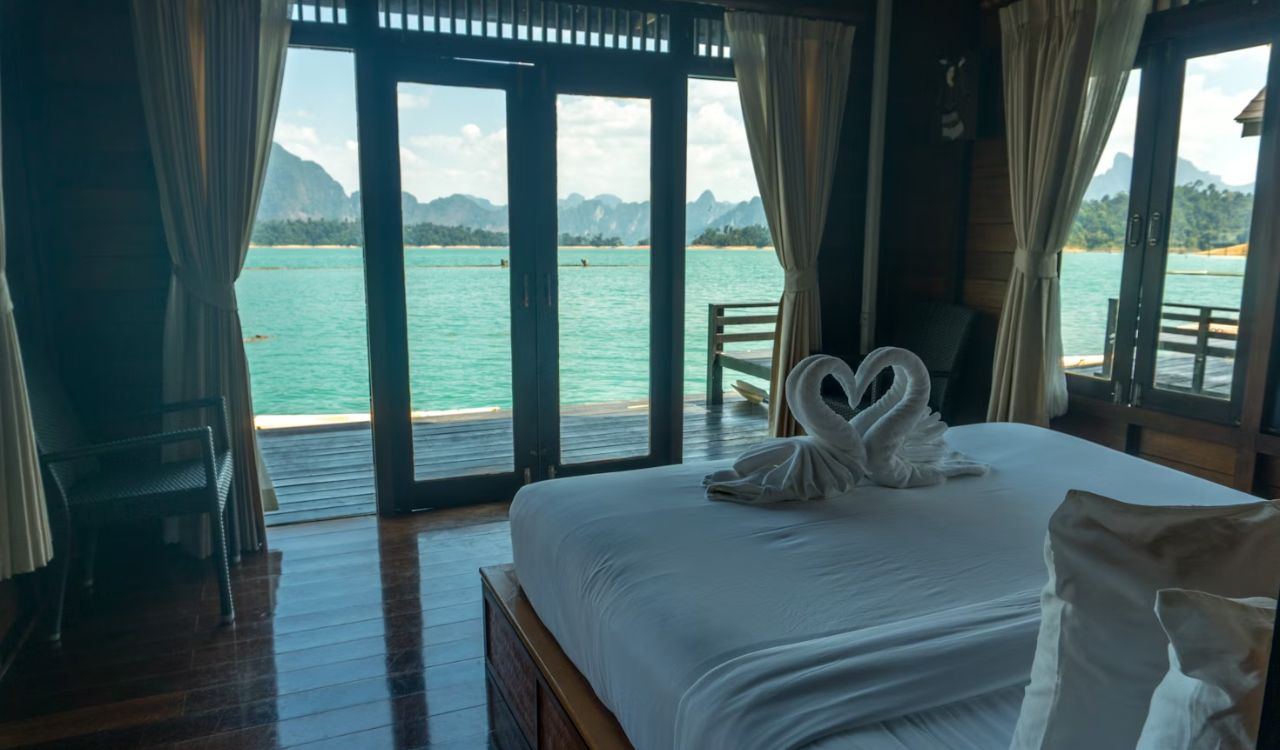 A room with a bed and balcony