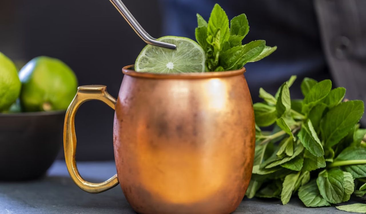 Brass colored mug with mule and lime