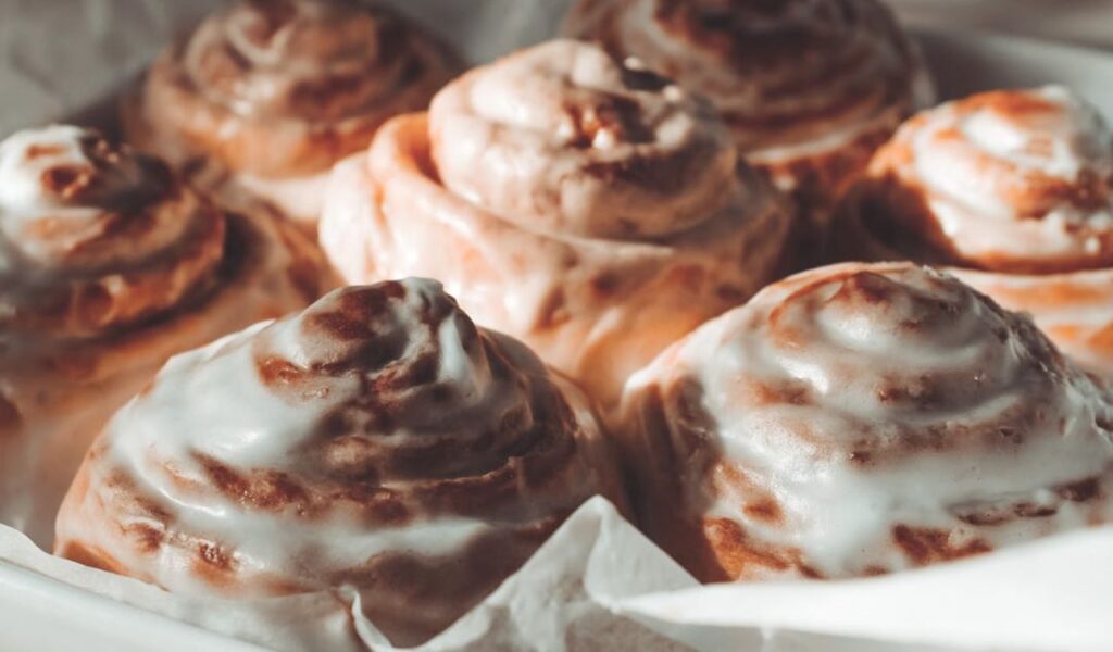 Cinnamon roll with powdered sugar glaze