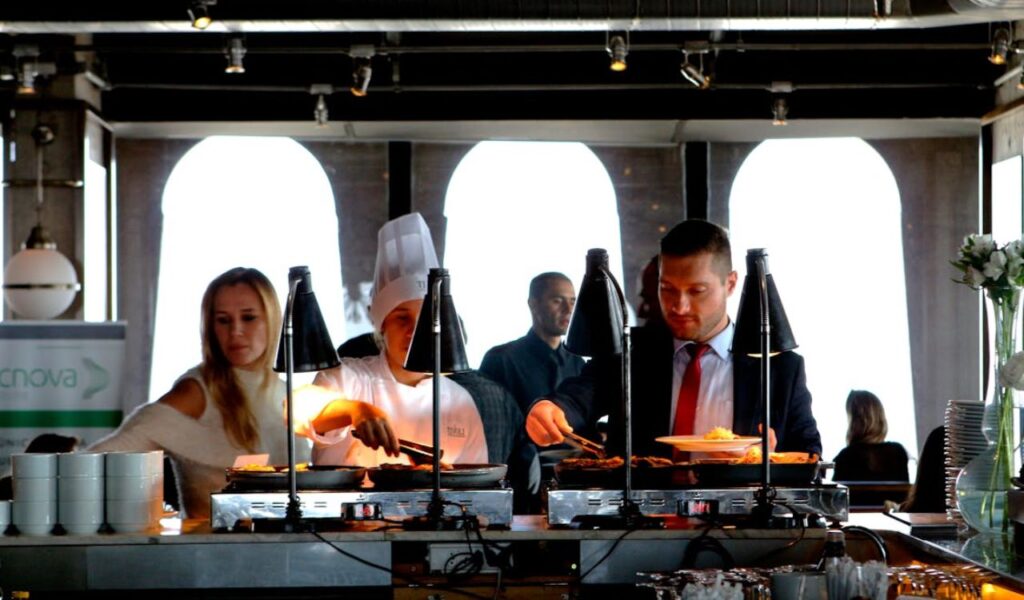 People getting food from buffet