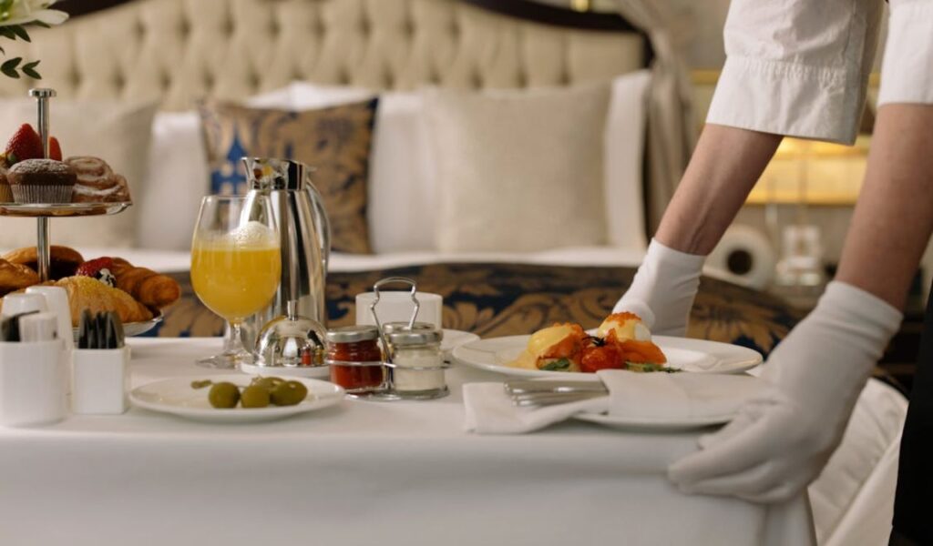 Person serving breakfast in a room
