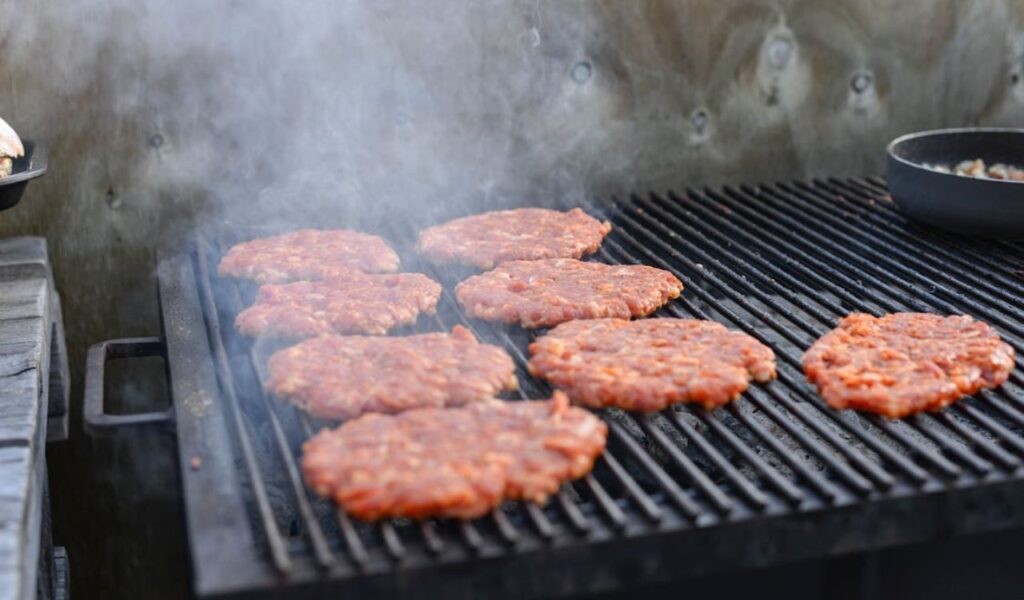 Raw patties on the grill