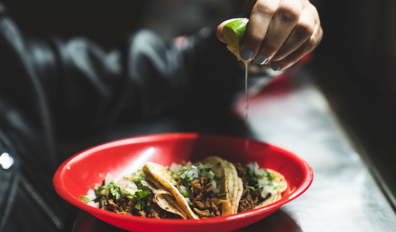 Squeezing lime on tacos