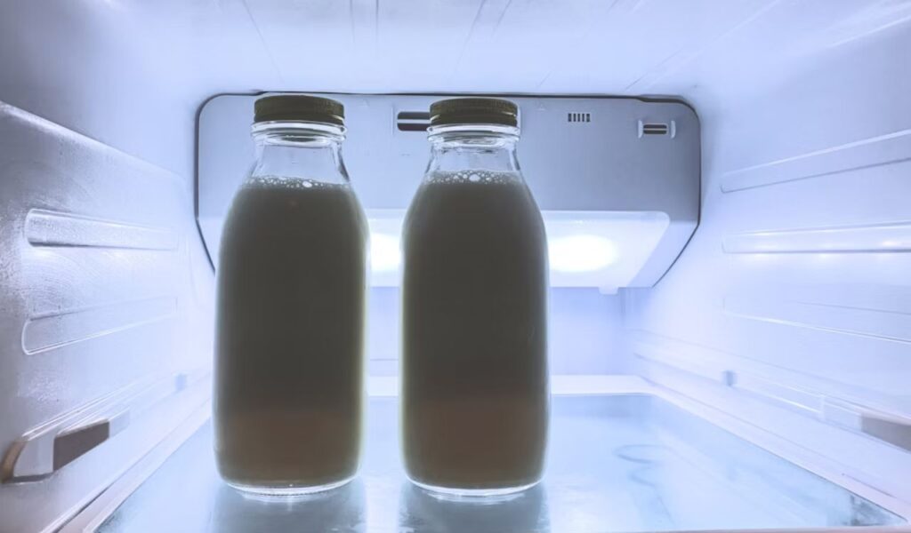 Two bottles of milk in refrigerator