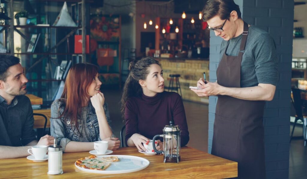 Waiter taking order
