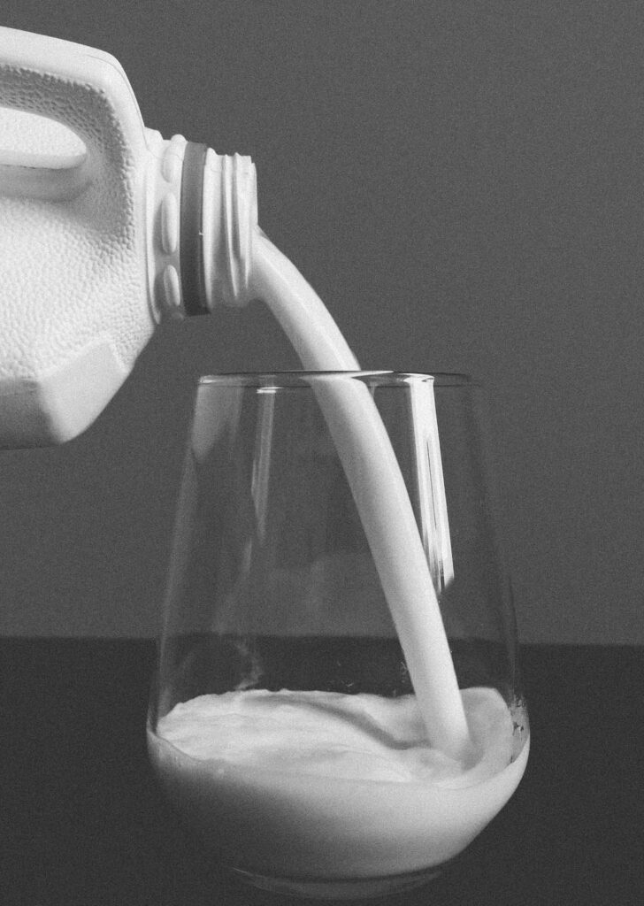 Buttermilk poured into a tall chilled glass.