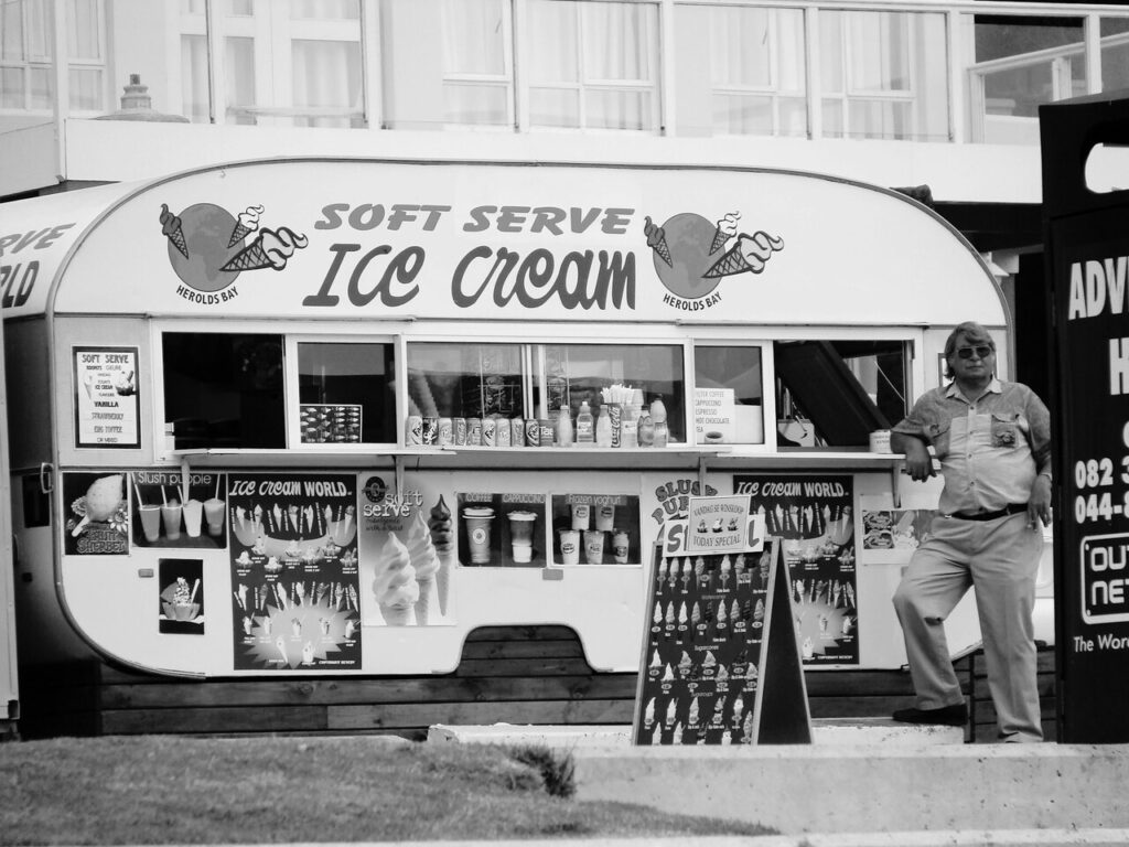 A vintage-style ice cream truck parked