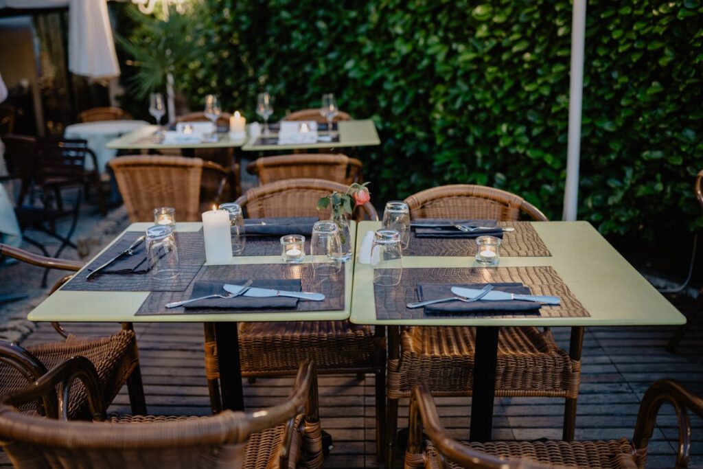 A formal dining table with napkins set properly