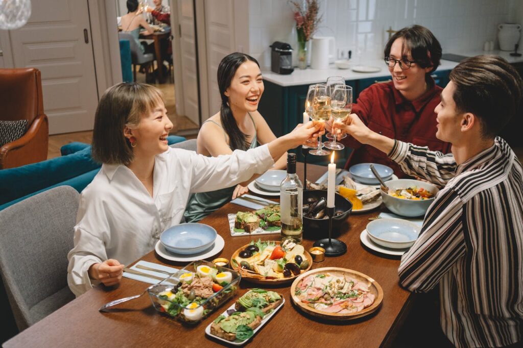 Guests sitting at a well-prepared dinner spread