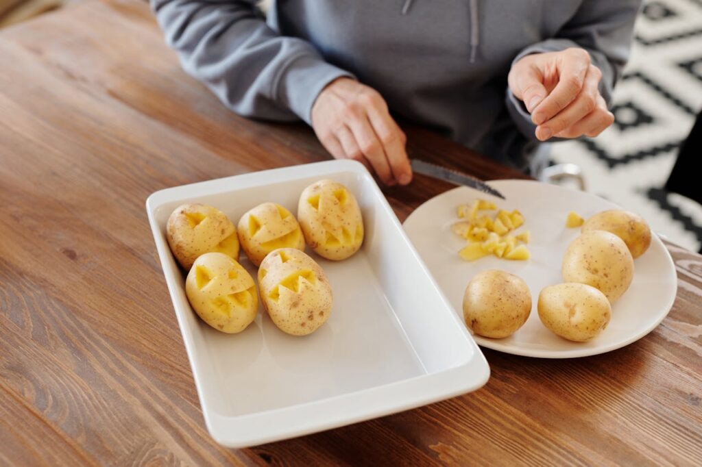 lady cooking with potatoes 