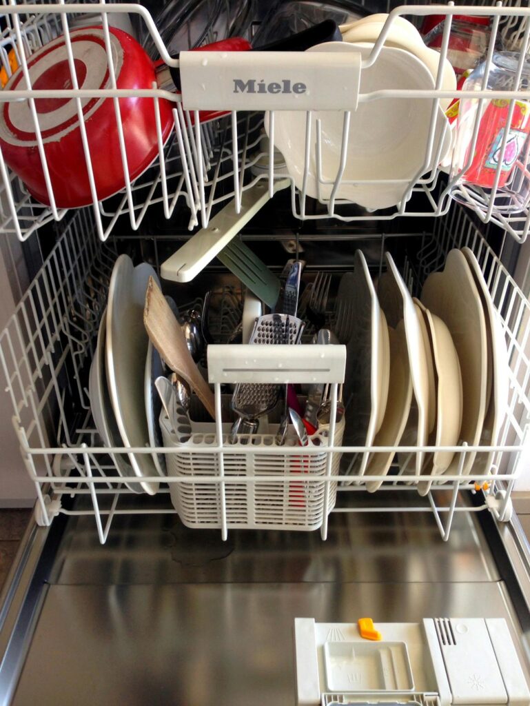 utensils loading in dishwasher