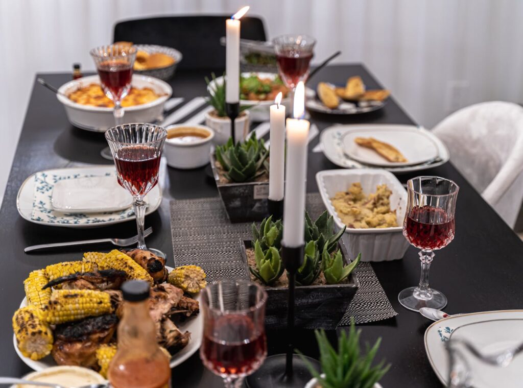 Stylish Table Setting with Cooked Food and Crystal Glasses