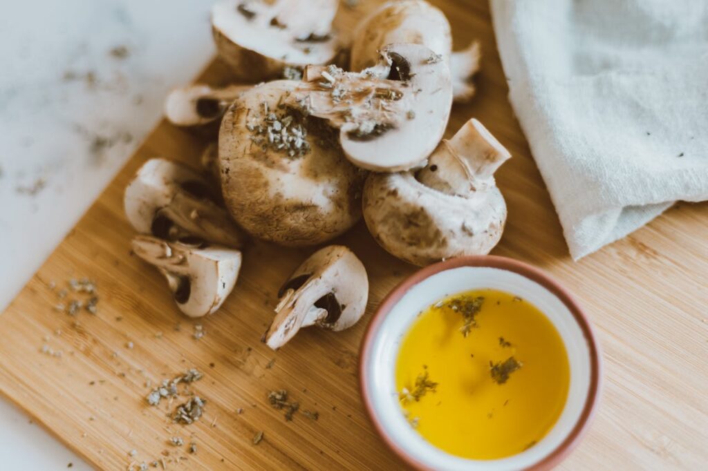Mushrooms with Dip on the Side on Brown Wooden Surface