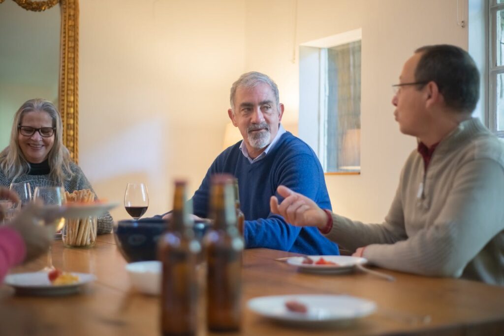 Guests smiling as conversation continues naturally