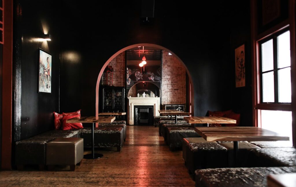 A dimly lit restaurant interior with candles and cozy seating