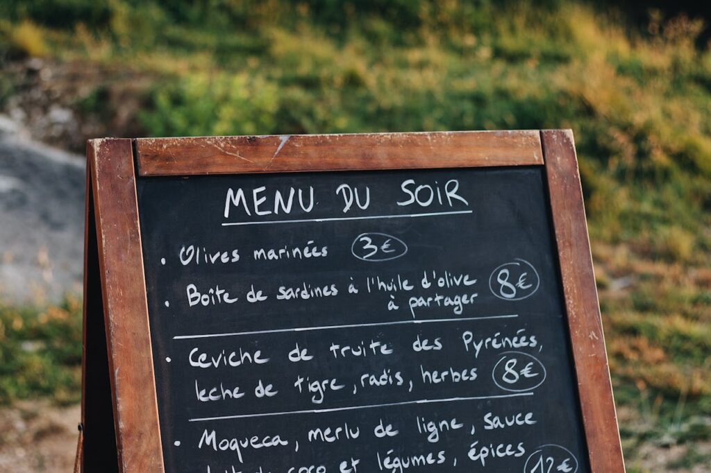 A chalkboard menu with a single “premium” dish listed prominently.