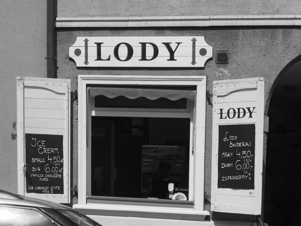 A vintage storefront photo of an early ice cream parlor