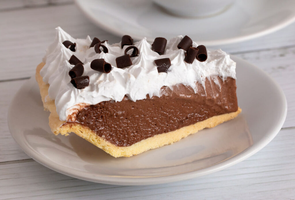 A French Silk Chocolate Cream Pie with Whipped Topping and Chocolate Curls
