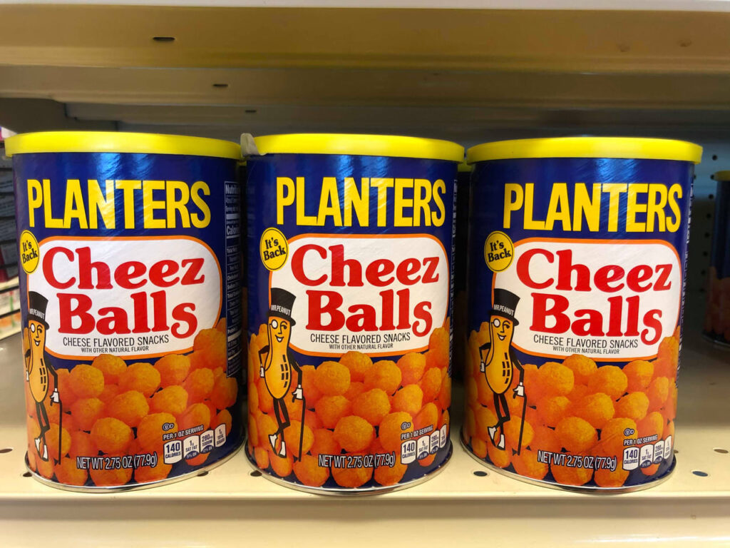 A Boxes of planters cheese balls on Shelve At Grocery Store, planters cheese balls Is The Kraft Heinz Company Brand.