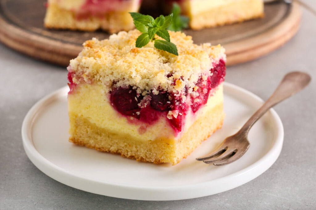 Cherry and coconut cheesecake, served on plate