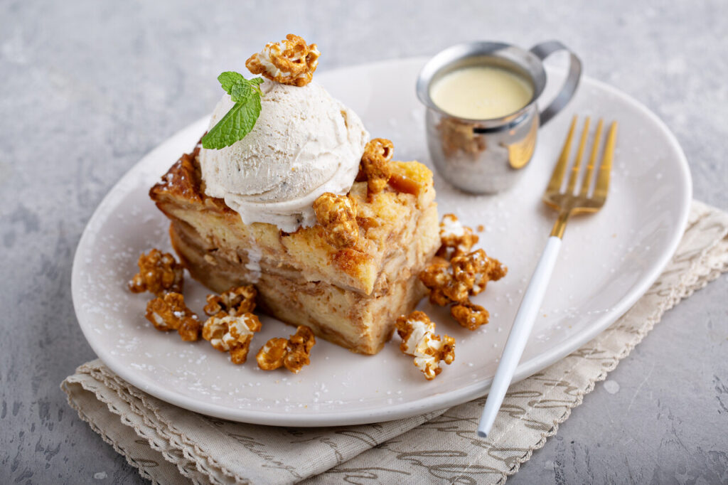 Caramel apple bread pudding with ice cream and popcorn, fall dessert
