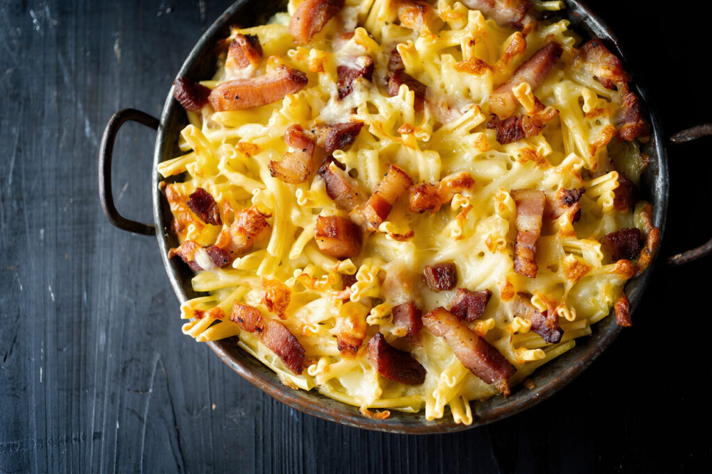 close up of pan of rustic italian american baked cheesy ziti pasta
