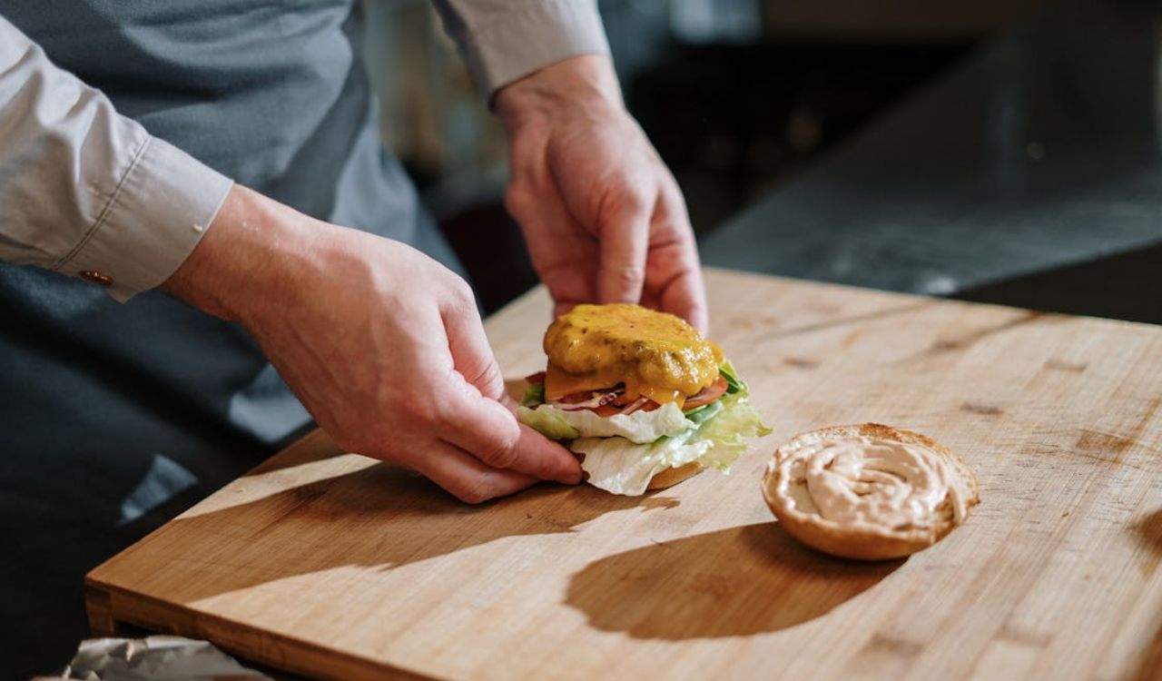 Burger on wooden chopping board