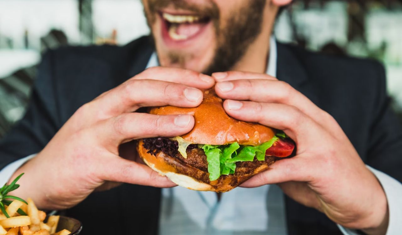 Eating fast food burger