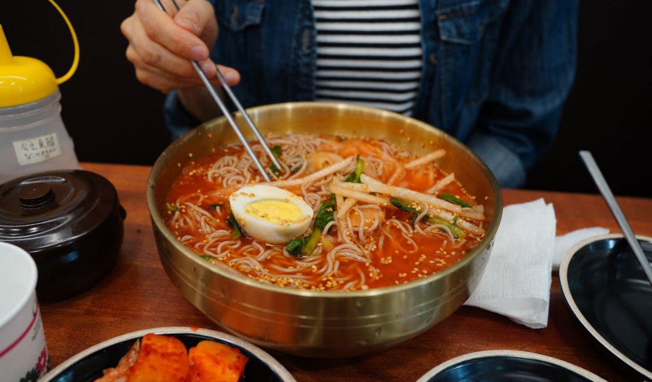 Eating spicy noodles