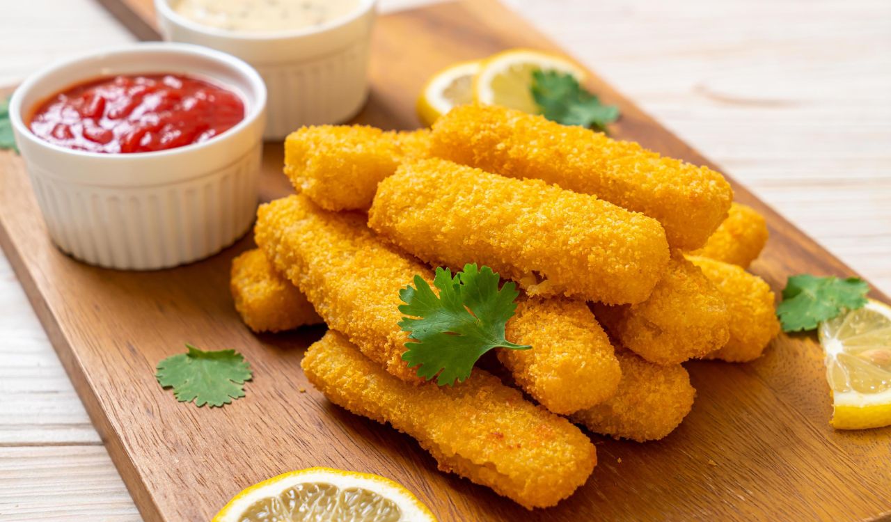 Fish sticks on a wooden board