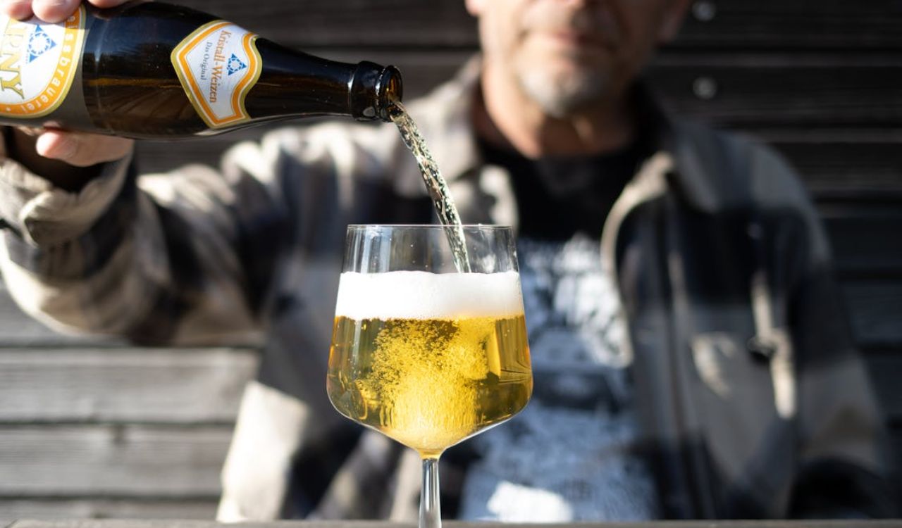 Man pouring beer in glass