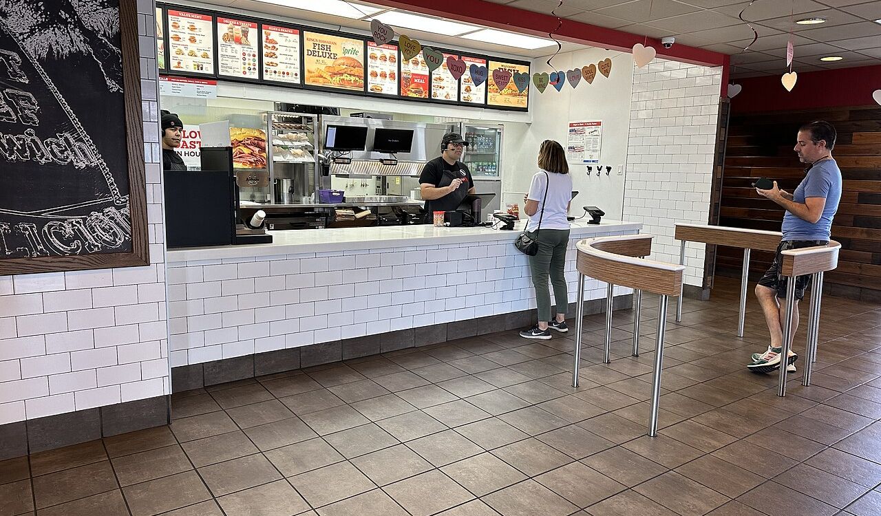 People ordering at Arby's