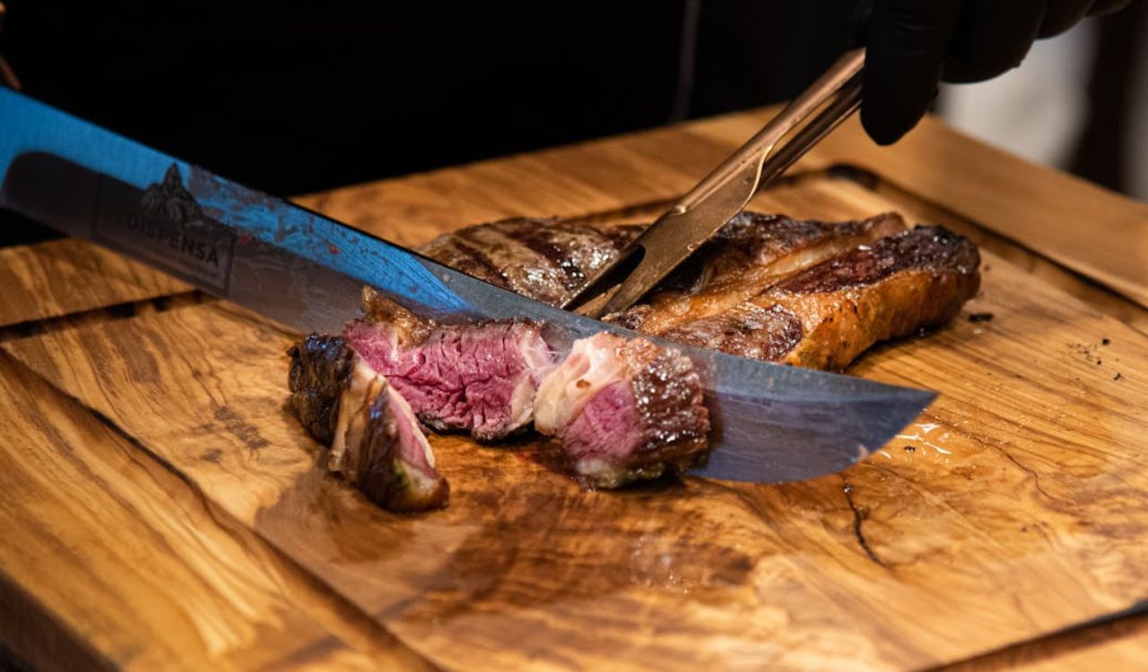 Slicing steak on a chopping board