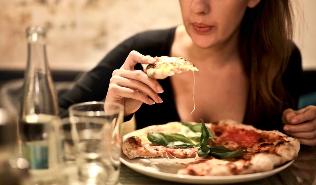 Woman eating a pizza