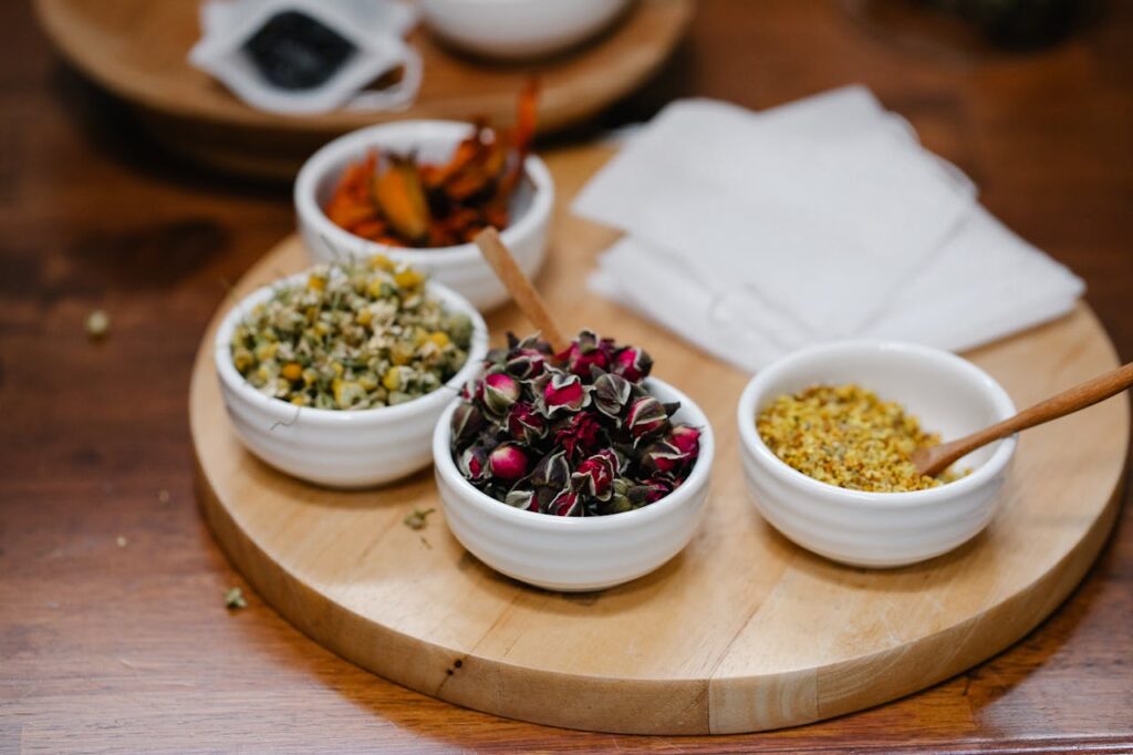 A rustic kitchen scene with Cajun spices like paprika, cayenne, and thyme in small bowls.