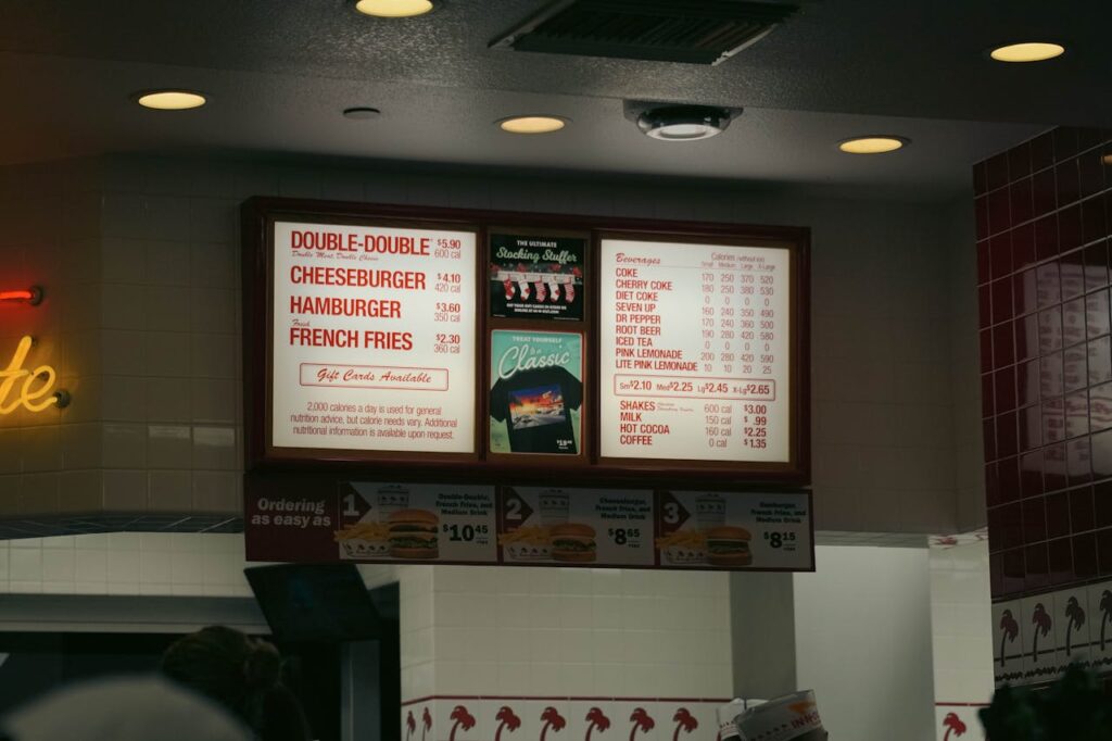 Fast-food digital menu with tiny calorie numbers