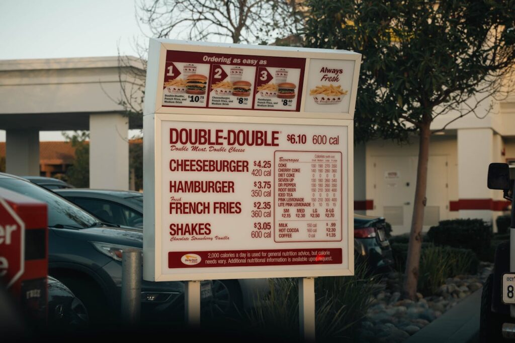 Menu board showing combo prices beside individual item prices