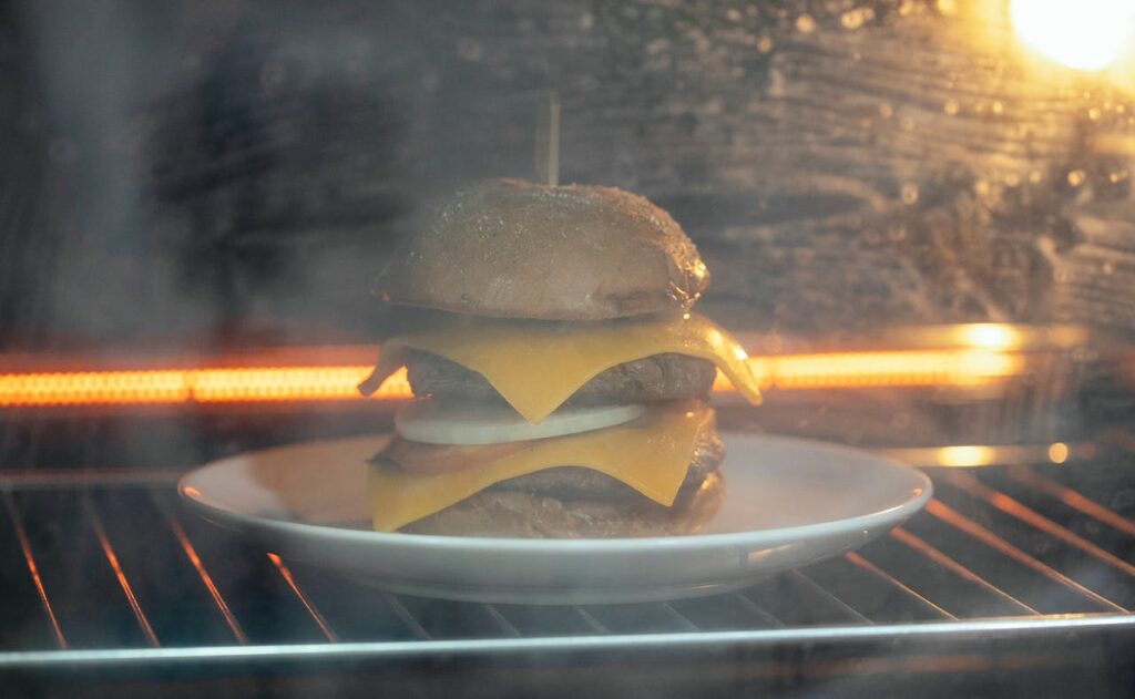 Delicious burger placed in oven