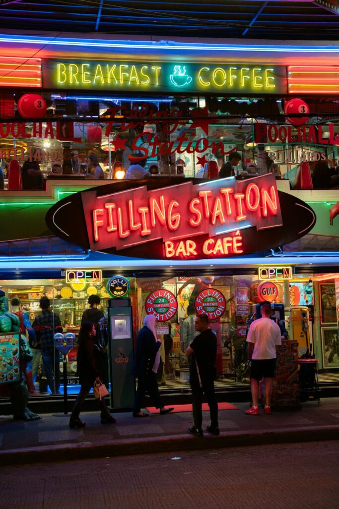 vintage restaurant line, host with clipboard, diners chatting while waiting.